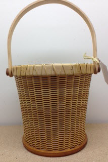 9 1/2" Nantucket beer bucket. Cherry base Maple rim and handle. With metal lined will hold six long neck bottles