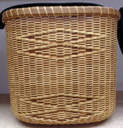 Nantucket double wine tote with basket embroidered strap. Cherry stave rim and base. Double diamond accent 9 x 5 1/2 x 8 1/2.